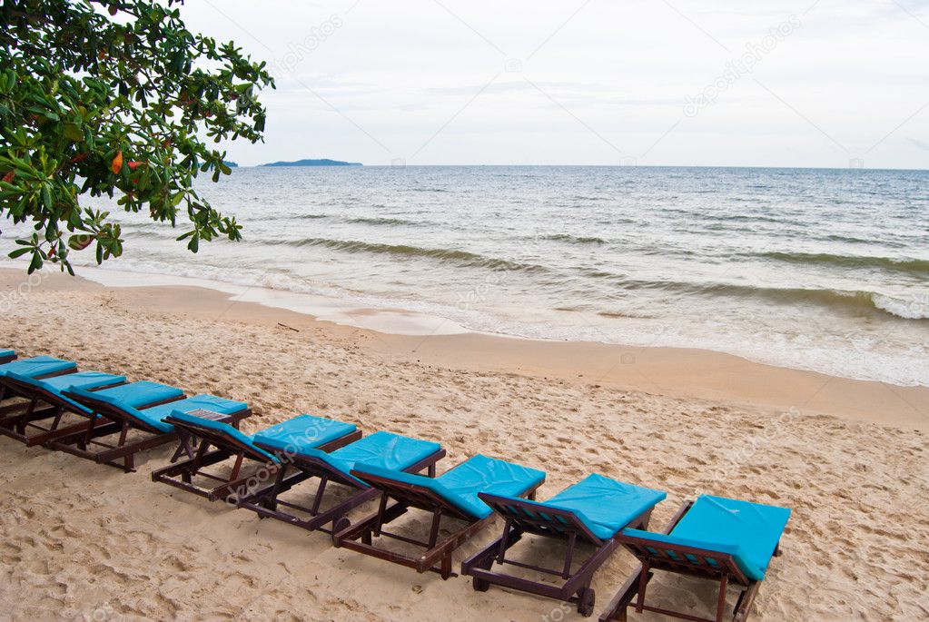 Line of blue beach bed on the beach, Sihanoukville, Cambodia