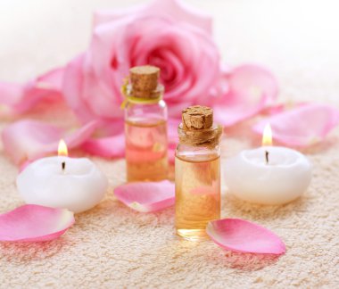 Bottles of Essential Oil for Aromatherapy. Rose Spa clipart