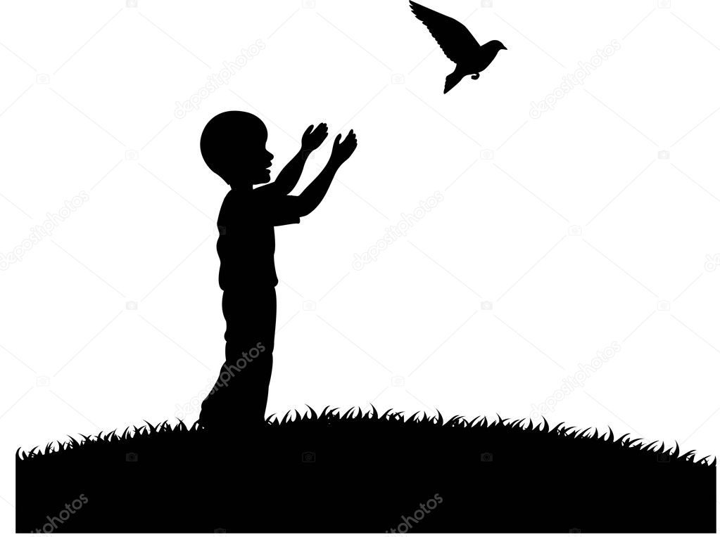 Little boy releasing a white pigeon