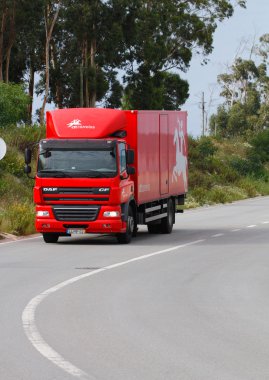 Portugese mail truck on the road clipart