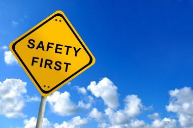 Safety first traffic sign on bluesky clipart