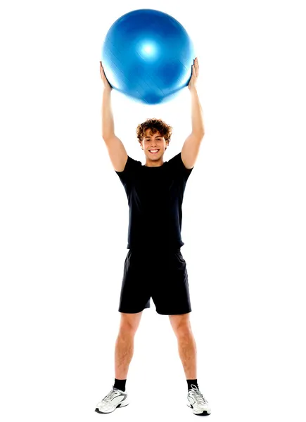 Man with big ball over his head — Stock Photo, Image