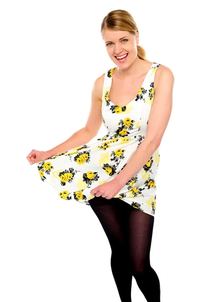 Happy trendy girl showing her new dress — Stock Photo, Image