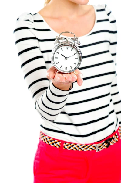 Cropped image of a woman holding alarm clock — Stock Photo, Image