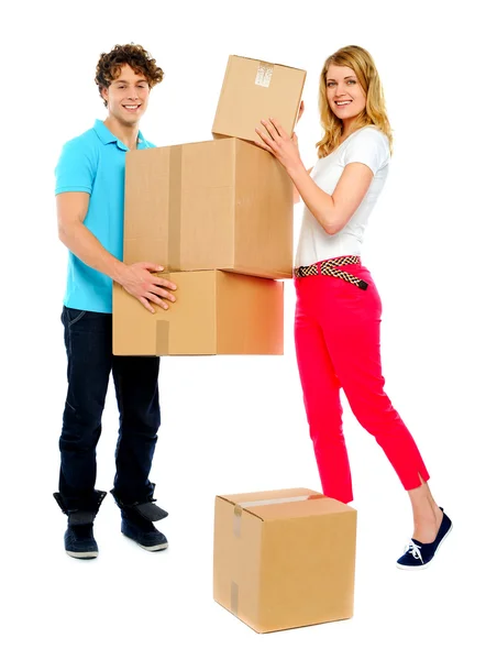 Lovely couple holding cardboard boxes — Stock Photo, Image