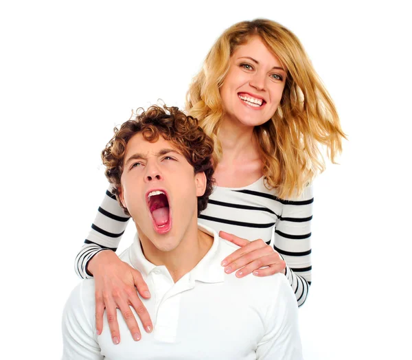 Couple, girl smiling boy yawning — Stock Photo, Image