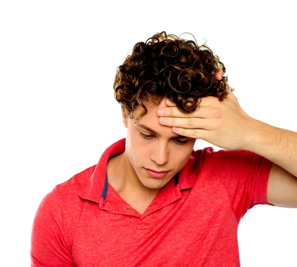 Stressed out guy with hand on his forehead — Stock Photo, Image