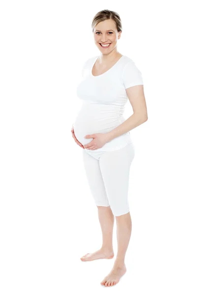 Embarazada acariciando su vientre — Foto de Stock