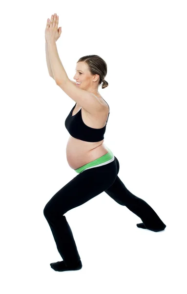 Healthy pregnant woman doing gymnastics — Stock Photo, Image