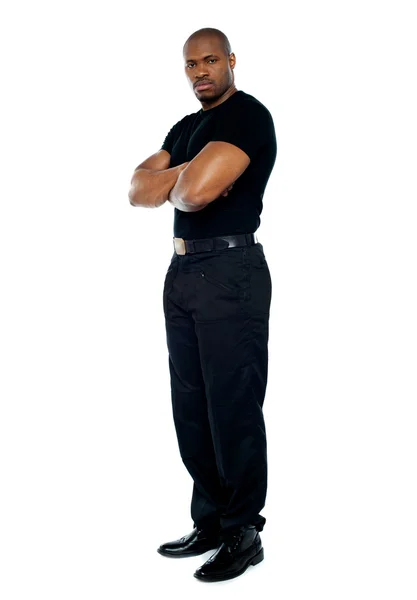 Male security guard with strong arms crossed — Stock Photo, Image