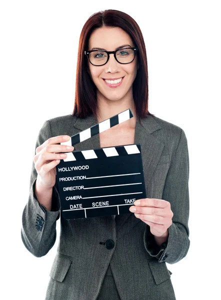 Business lady holding clapperboard — Stock Photo, Image