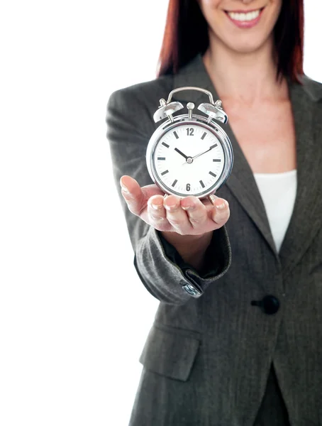Cropped image of a woman holding alarm clock — Stock Photo, Image