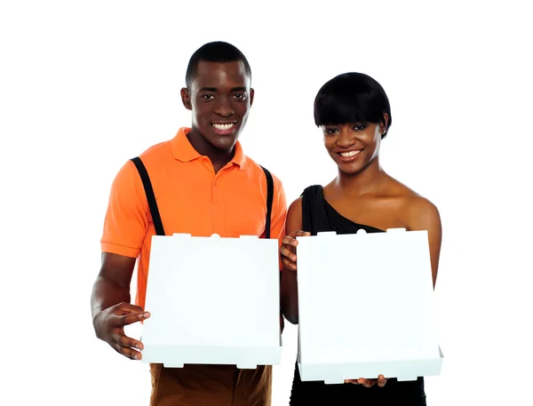 Beautiful young couple with pizza boxes — Stock Photo, Image