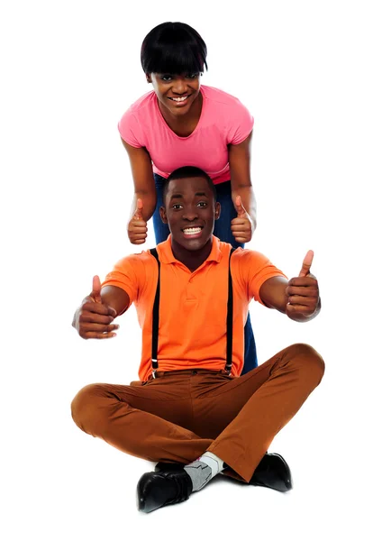 Couple showing double thumbs-up to camera — Stock Photo, Image