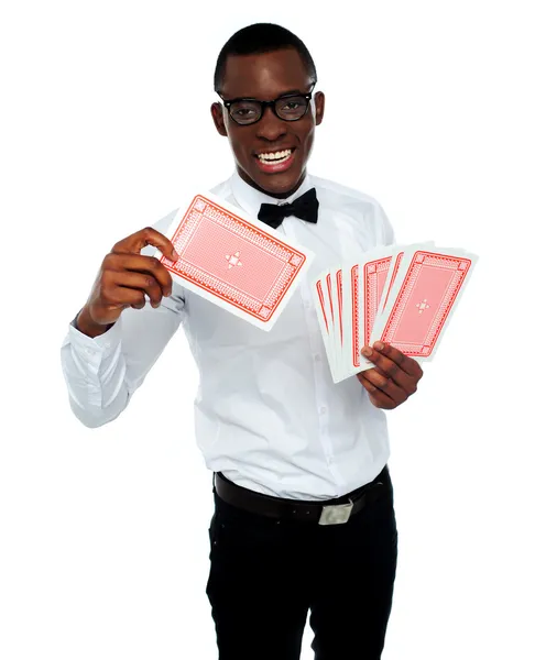 Young black boy ready to show his trump card — Stock Photo, Image