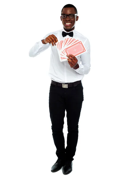 Portrait of a young man holding cards — Stock Photo, Image