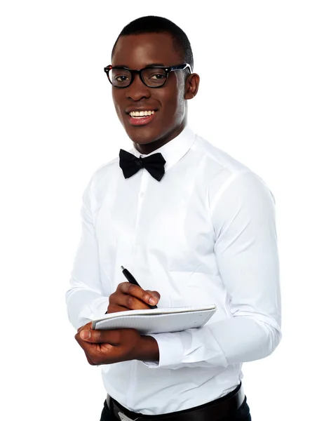 Smart african writing on clipboard — Stock Photo, Image
