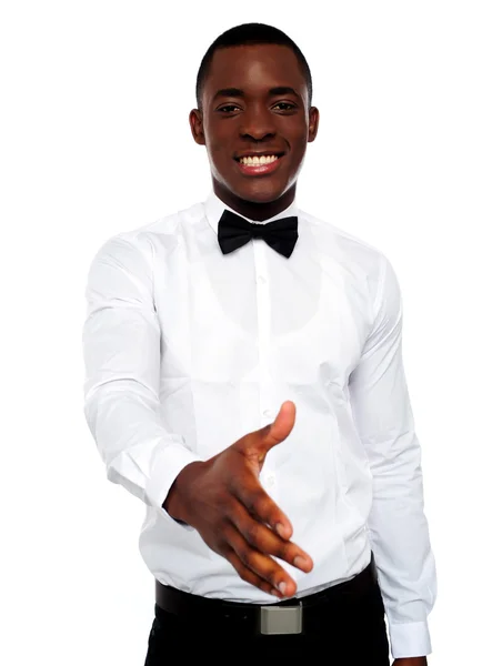 Attractive young man offering handshake — Stock Photo, Image
