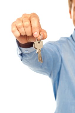 Man holding keys. Shallow DOF clipart