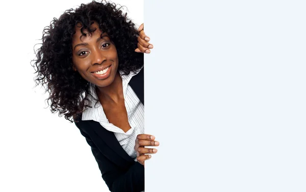 Businesswoman holding a long blank banner ad — Stock Photo, Image
