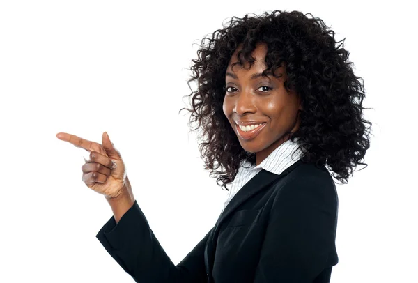 Corporate woman indicating towards copy space — Stock Photo, Image