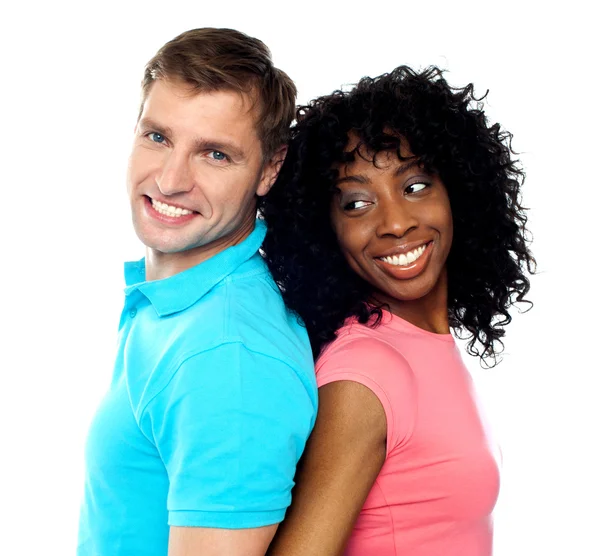 Closeup shot of young couple. Back to back — Stock Photo, Image