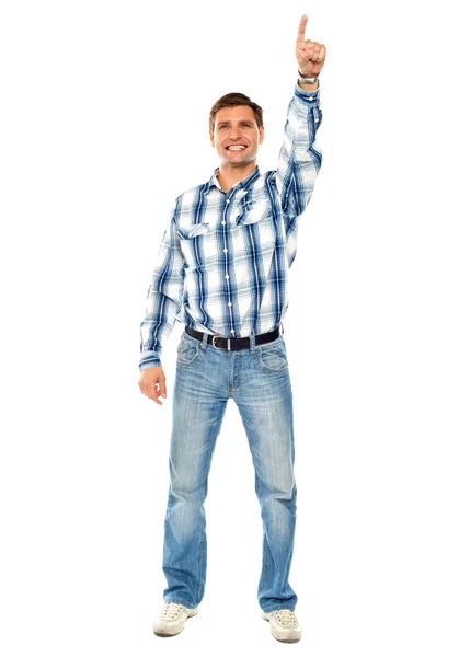 Happy young guy pointing upwards. Full shot — Stock Photo, Image