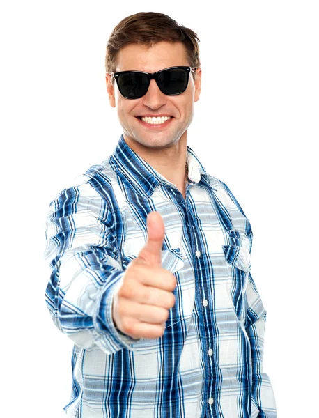 Smart young guy showing thumbs up — Stock Photo, Image