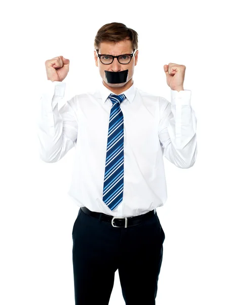 Angry young man with duct tape on his mouth — Stock Photo, Image