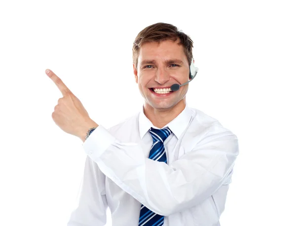 Customer service agent pointing away — Stock Photo, Image