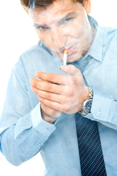 Young man lighting a cigarette — Stock Photo, Image
