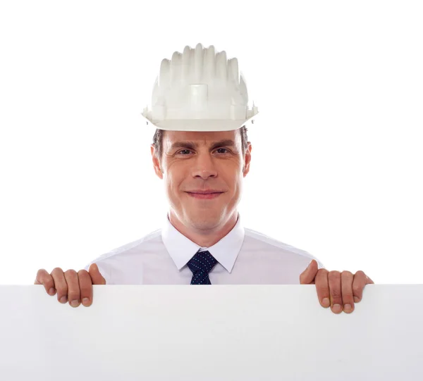 Ein Architekt mit weißem Plakat — Stockfoto