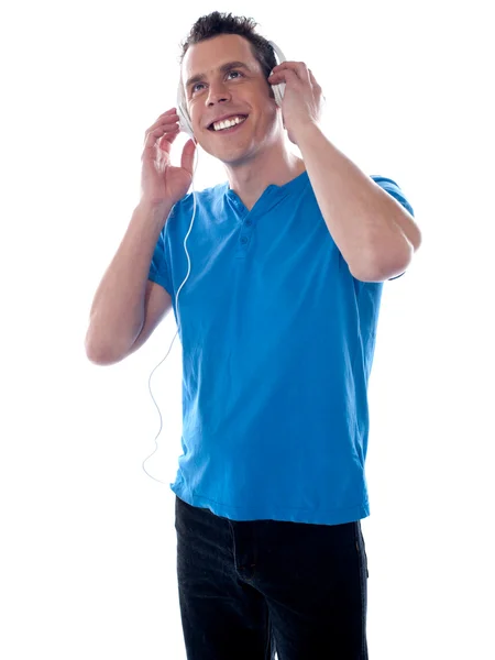 Attractive caucasian male listening music — Stock Photo, Image