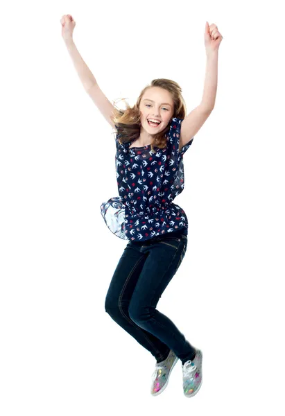 Young girl jumping in excitement — Stock Photo, Image