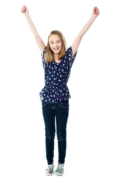 Excited school girl with raised arms — Stock Photo, Image