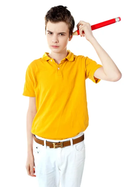 Boy cleaning his ear with big pencil — Stock Photo, Image