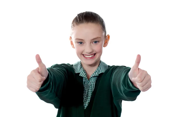 Little girl showing thumbs up to camera — Stock Photo, Image