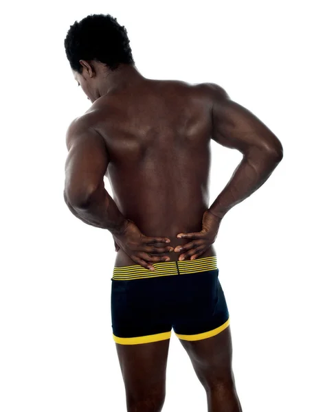 Posture arrière du jeune entraîneur masculin en forme — Photo