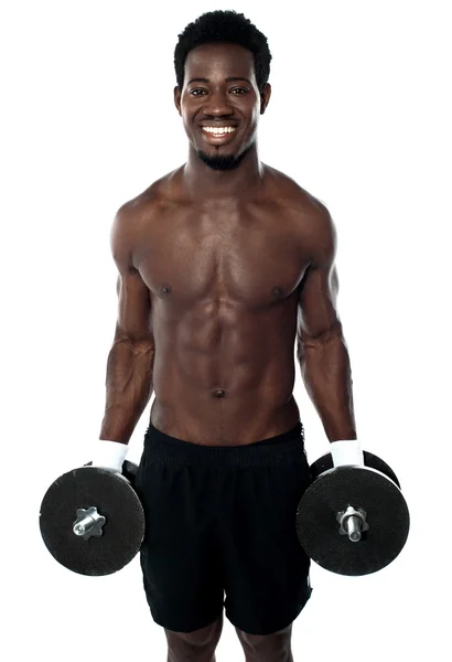 Attractive man posing with dumbbells — Stock Photo, Image