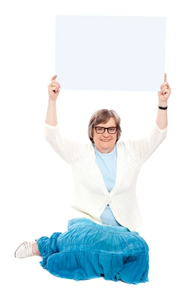 Seated representative showing white billboard — Stock Photo, Image