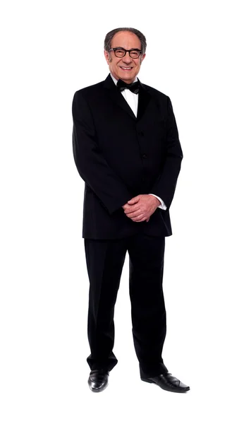 Attractive senior man posing in tuxedo — Stock Photo, Image