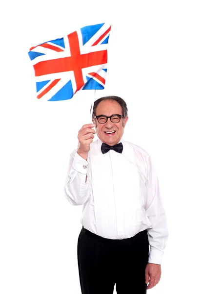 Hombre animando por el Reino Unido. Bandera ondeante —  Fotos de Stock