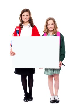 Schoolgirls holding big blank banner ad clipart