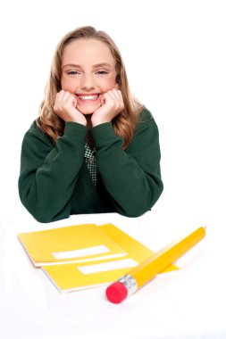 Isolated girl smiling with hands on chin clipart