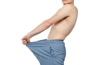 Cropped image of man wearing loose shorts clipart