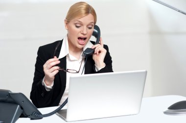 Woman trying to convince client over the phone clipart