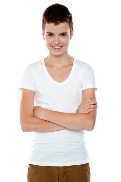 Smiling boy posing with crossed arms — Stock Photo, Image