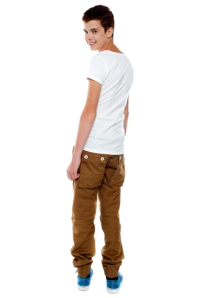 Trendy young boy turning back — Stock Photo, Image