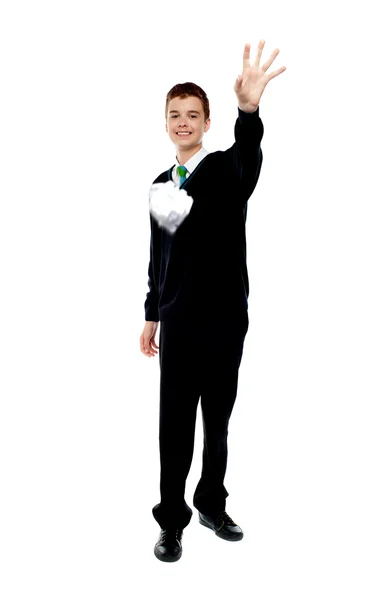 Cheerful young boy throwing paper — Stock Photo, Image