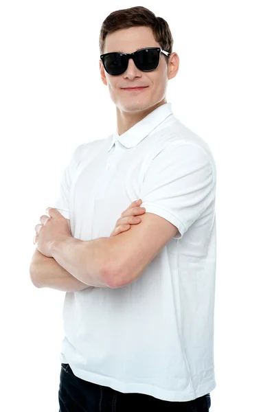 Casual young man posing with crossed arms — Stock Photo, Image